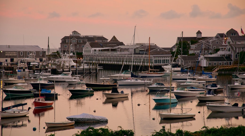 Ships in a harbor at Cape Cod at sunset.