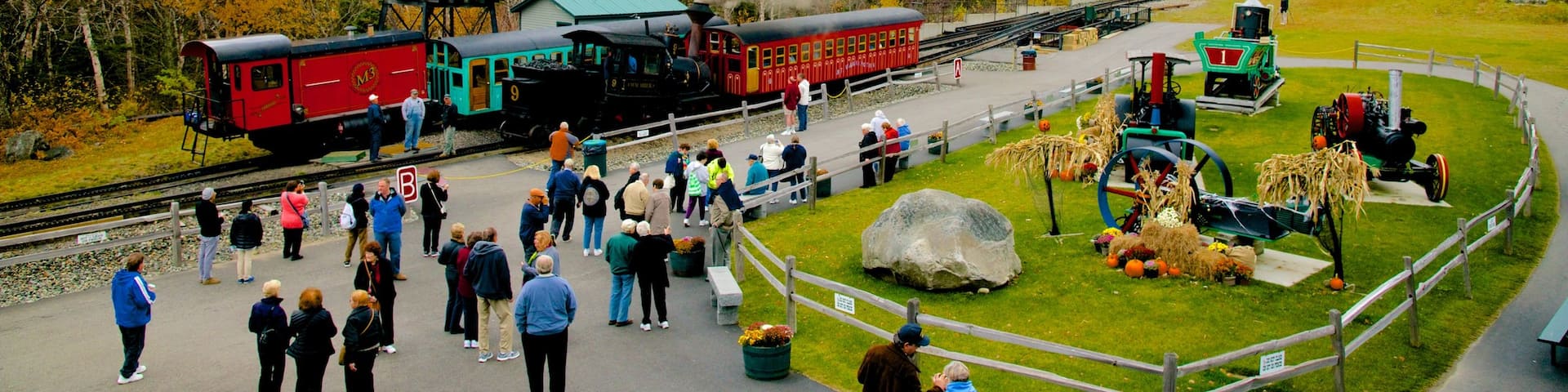 Mount Washington Cog Railway showing railway items as well as a large group of people