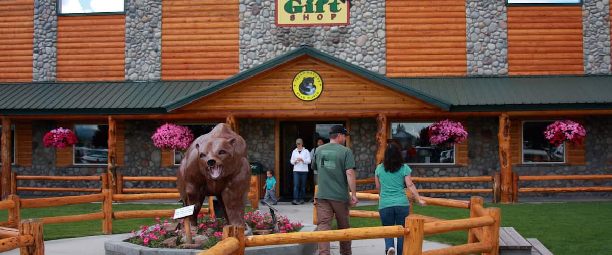 Rexburg showing shopping and a statue or sculpture as well as a couple
