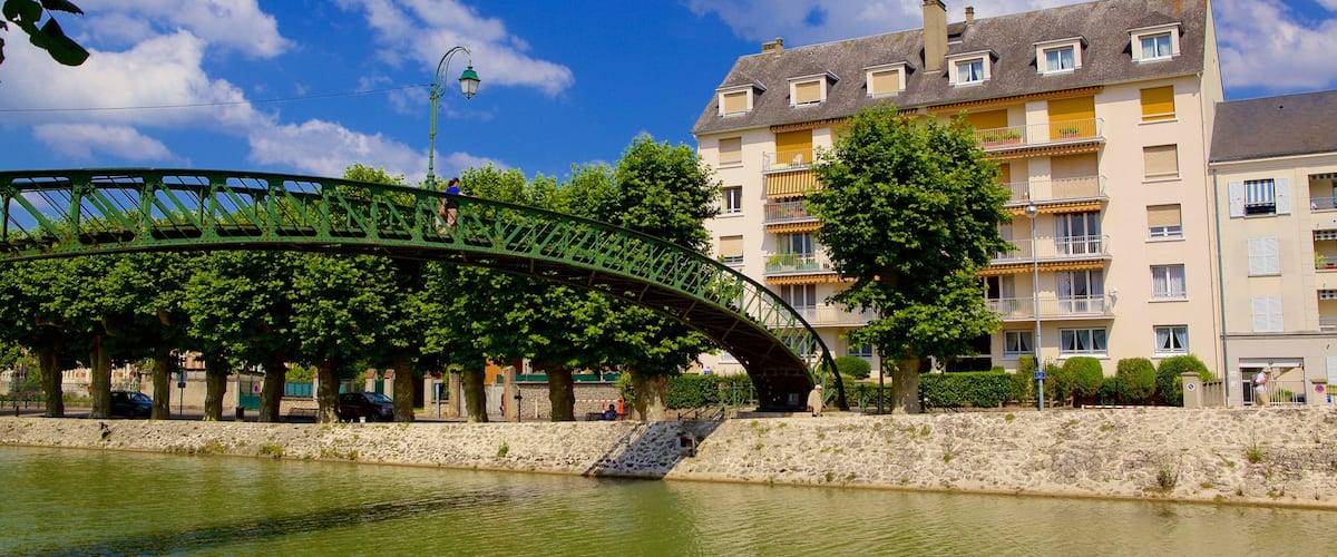 Montargis featuring a bridge, a house and a river or creek