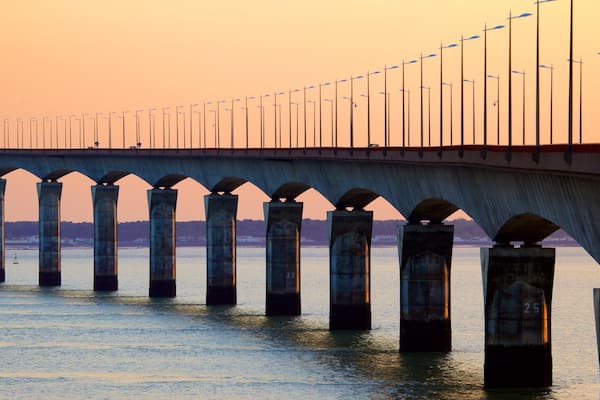 Ile de Re Bridge which includes a bridge and a sunset