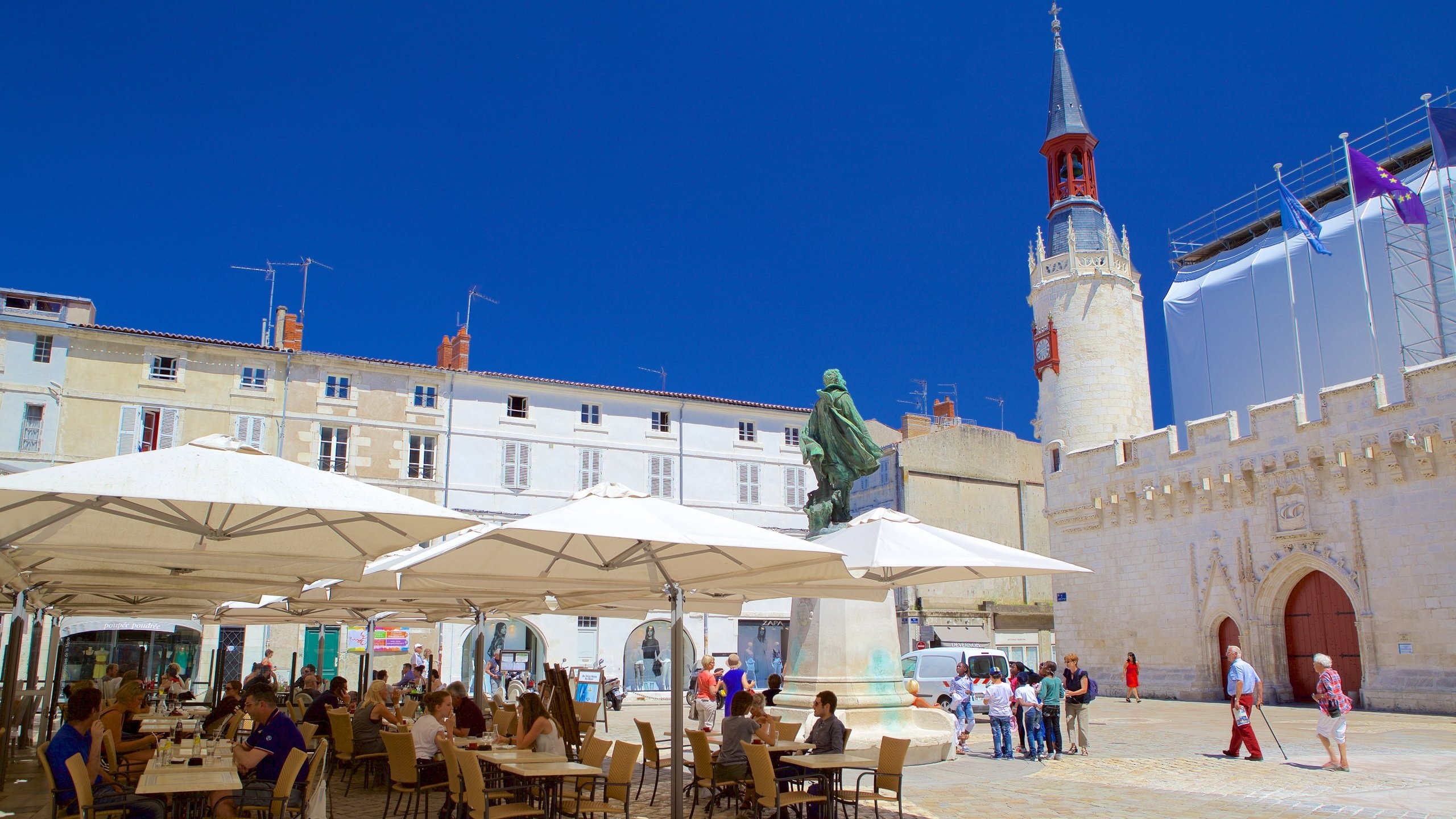 La Rochelle which includes a square or plaza and outdoor eating