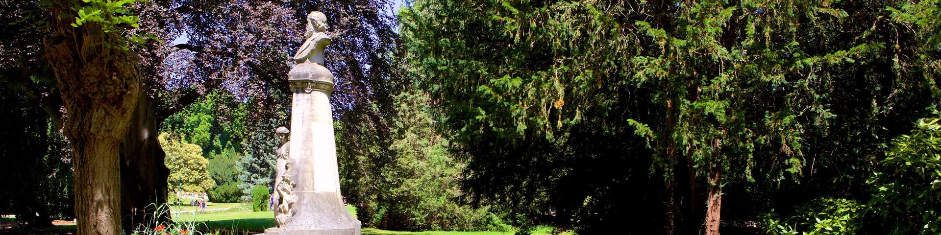 Parc de la Pepiniere featuring a garden and a statue or sculpture