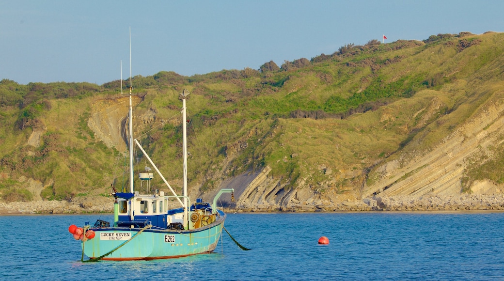 Lulworth Cove Beach featuring rugged coastline and boating