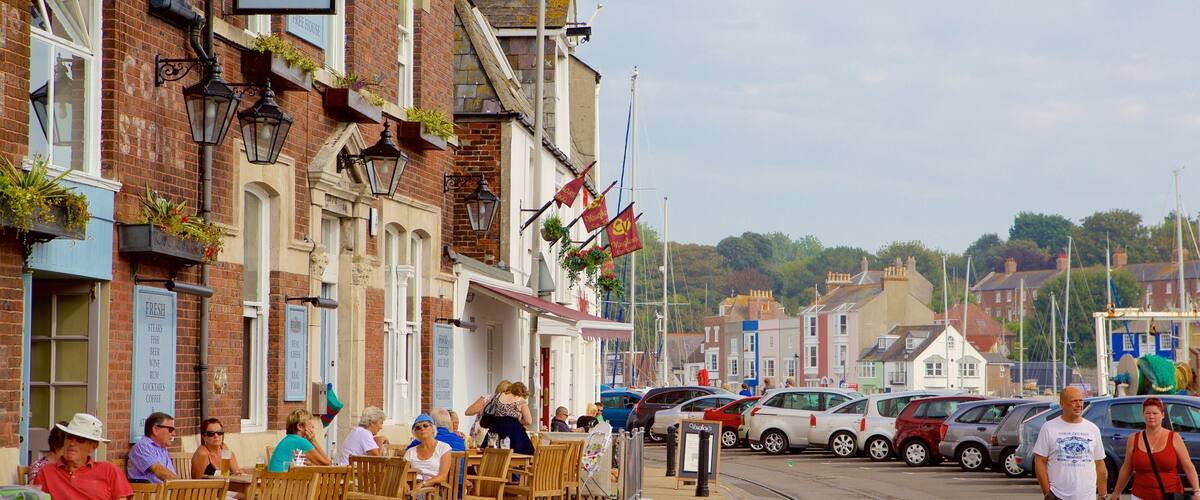 Weymouth featuring outdoor eating as well as a couple