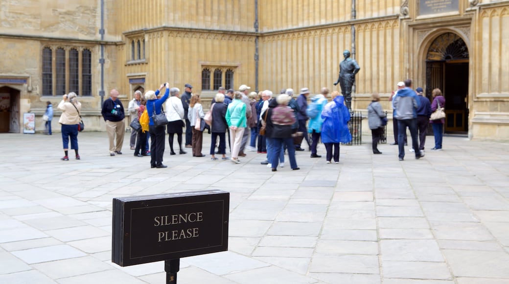 Bodleian Library featuring signage as well as a large group of people