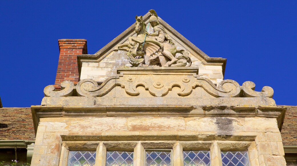 Anglesey Abbey featuring heritage elements and a statue or sculpture