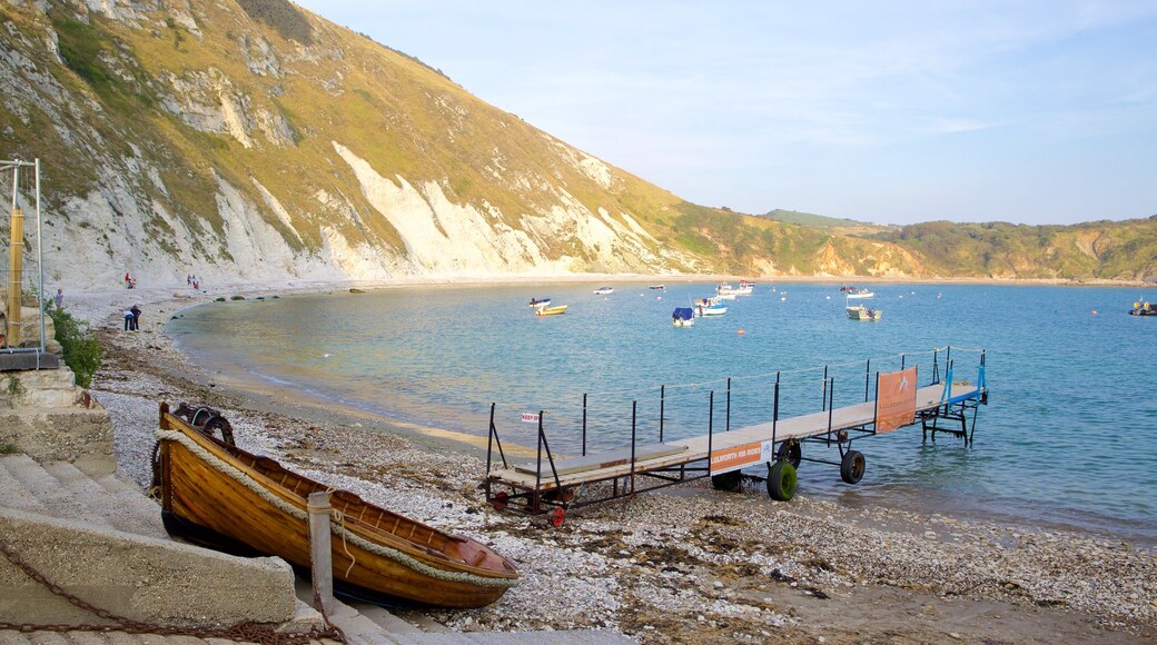 Lulworth Cove Beach showing a pebble beach, a bay or harbor and general coastal views