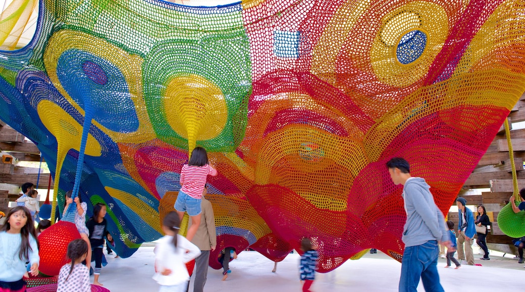 Hakone Open Air Museum featuring outdoor art and a playground as well as children
