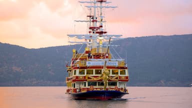 Lake Ashi which includes a lake or waterhole, sailing and a sunset