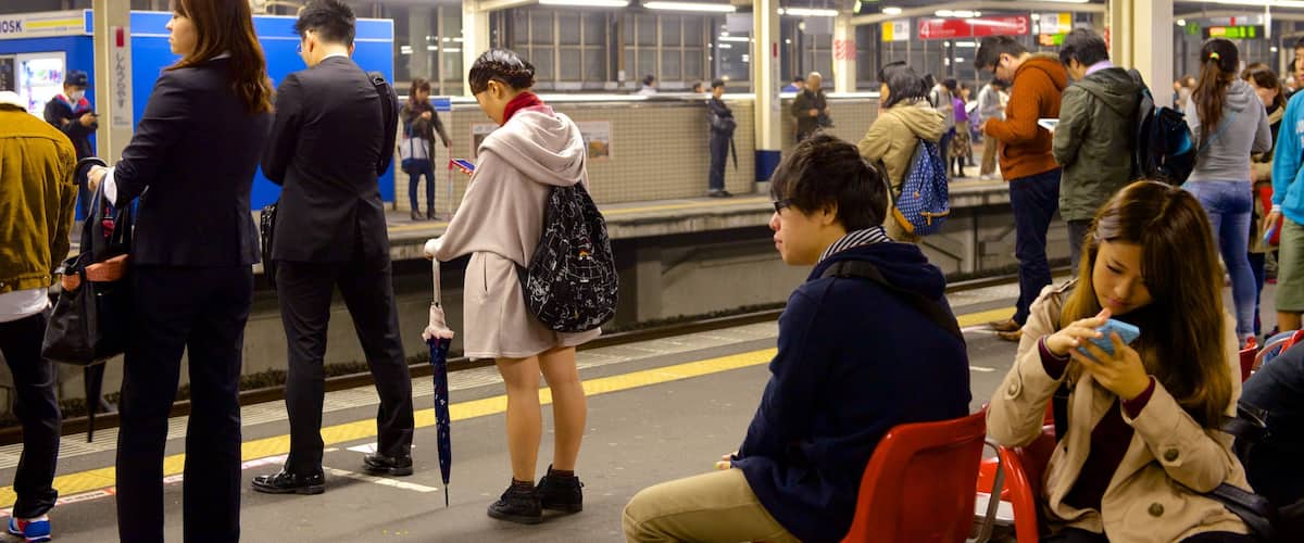 Urayasu featuring railway items as well as a large group of people