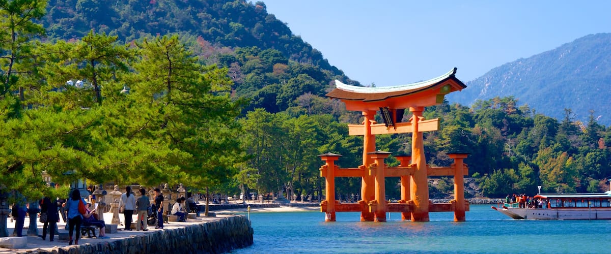Itsukushima Shrine which includes mountains and heritage elements