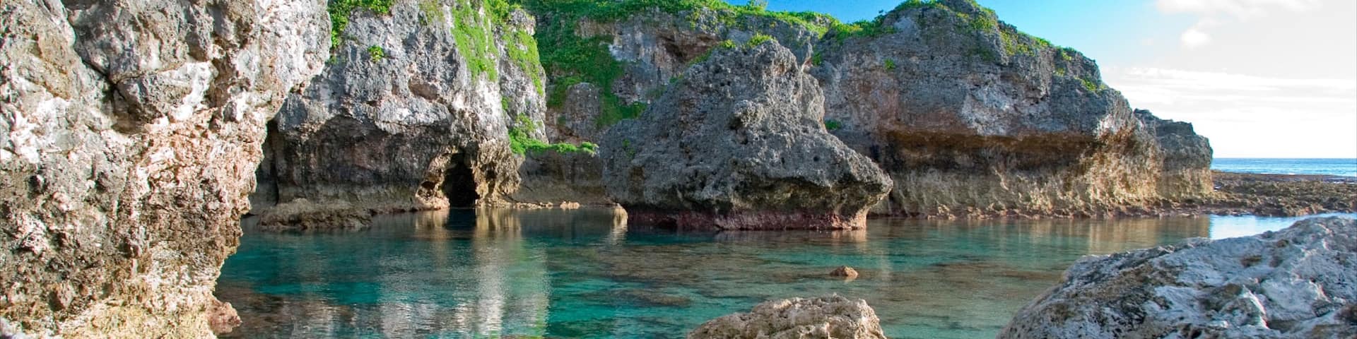Limu featuring rocky coastline and colorful reefs
