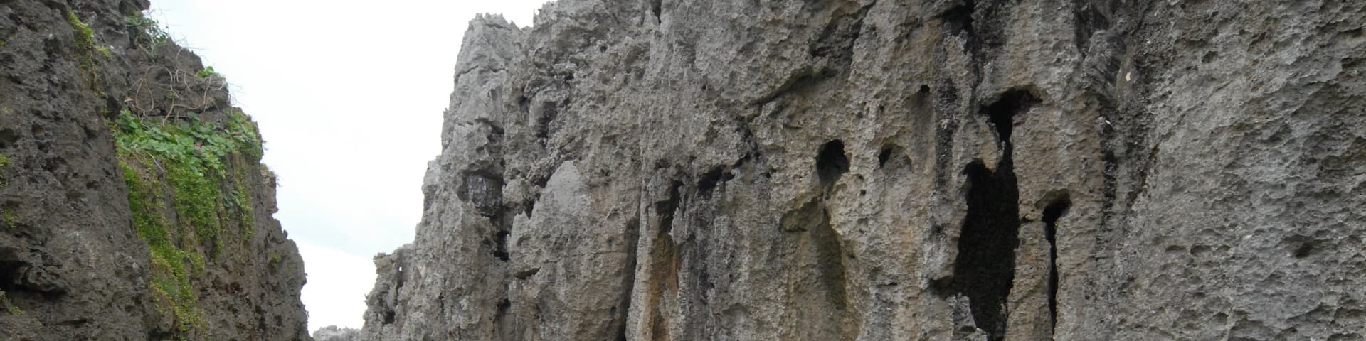 Togo Chasm which includes a gorge or canyon and hiking or walking as well as an individual male
