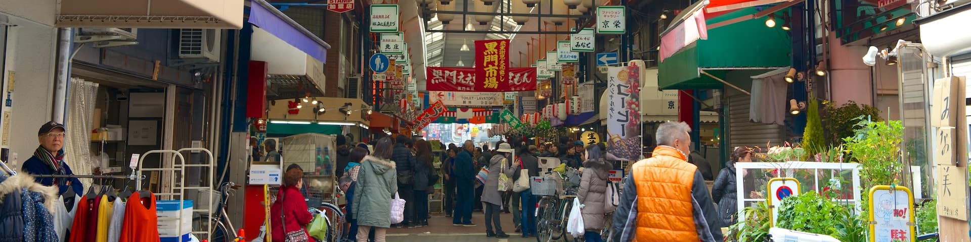 Satsumasendai which includes shopping as well as a large group of people