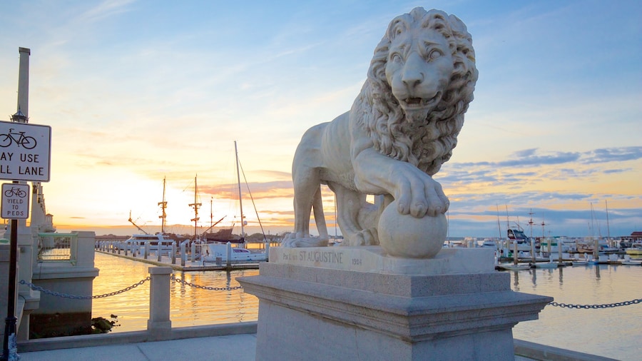 Bridge of Lions which includes a statue or sculpture, general coastal views and a sunset
