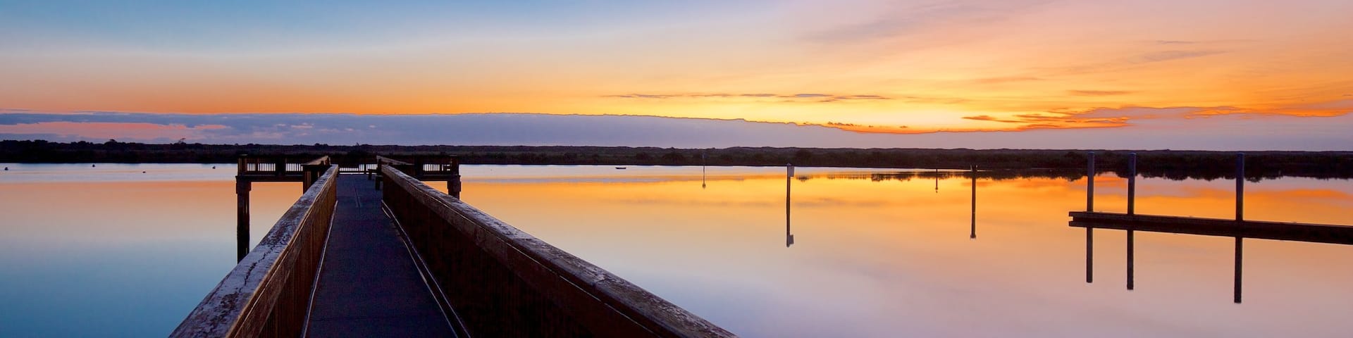 St. Augustine Lighthouse & Maritime Museum showing general coastal views and a sunset