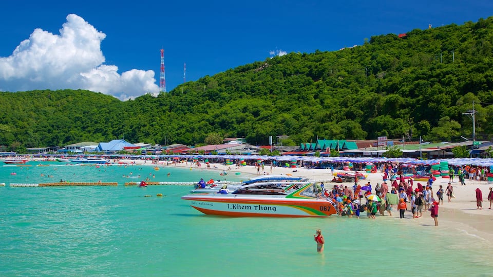 Ta-Yai Beach featuring boating and a sandy beach as well as a large group of people