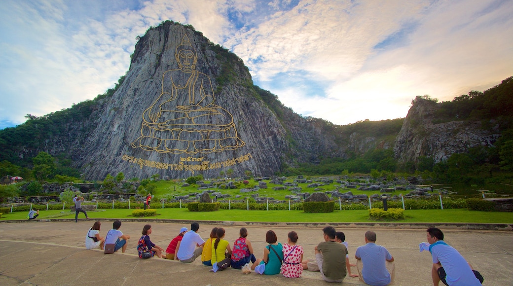 Buddha Mountain featuring mountains and religious aspects as well as a large group of people