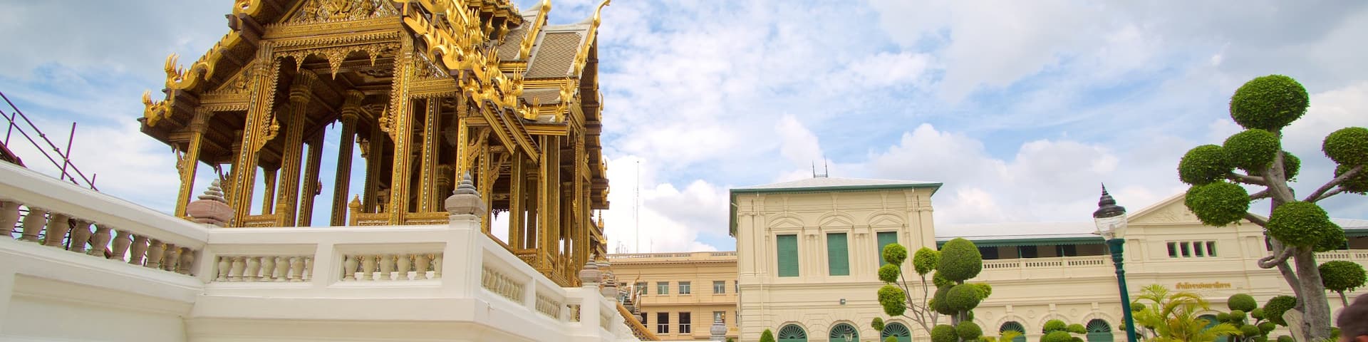 Grand Palace featuring a temple or place of worship as well as a small group of people