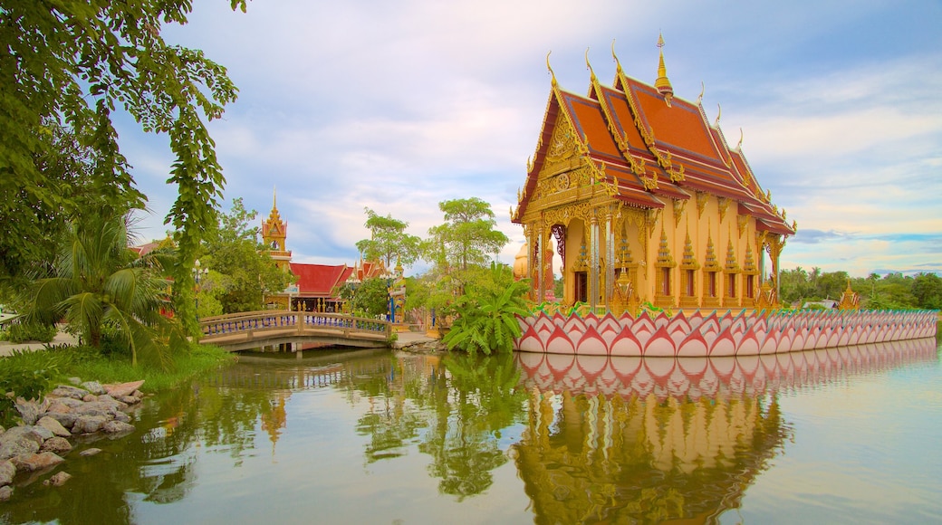 Wat Plai Laem which includes a temple or place of worship