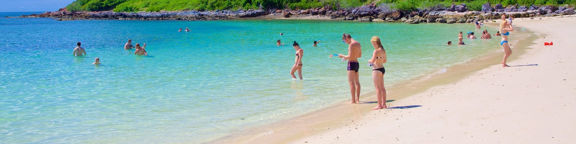 Nual Beach which includes swimming and a beach as well as a large group of people