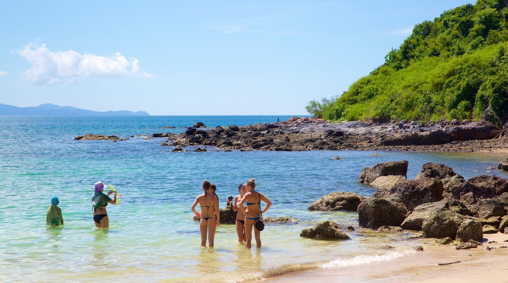 Nual Beach showing general coastal views, rocky coastline and swimming