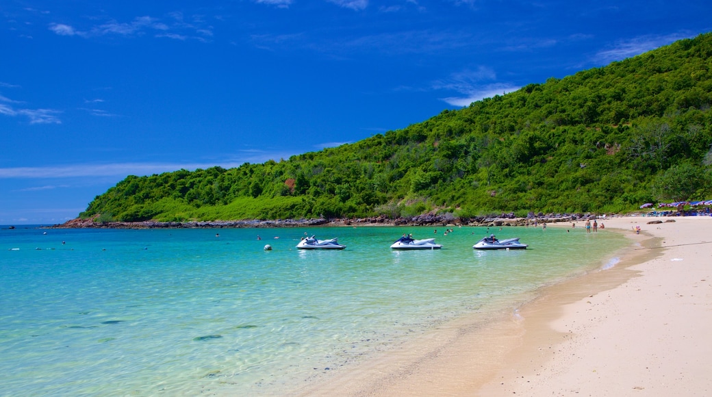 Nual Beach which includes a sandy beach and jet skiing