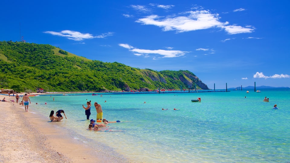 Samae Beach featuring a beach as well as a small group of people