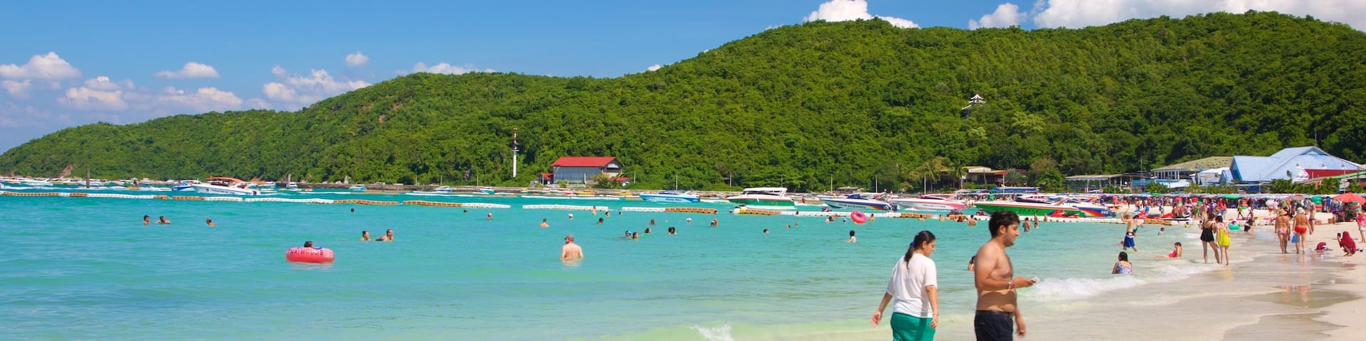 Ta-Yai Beach featuring a beach as well as a large group of people