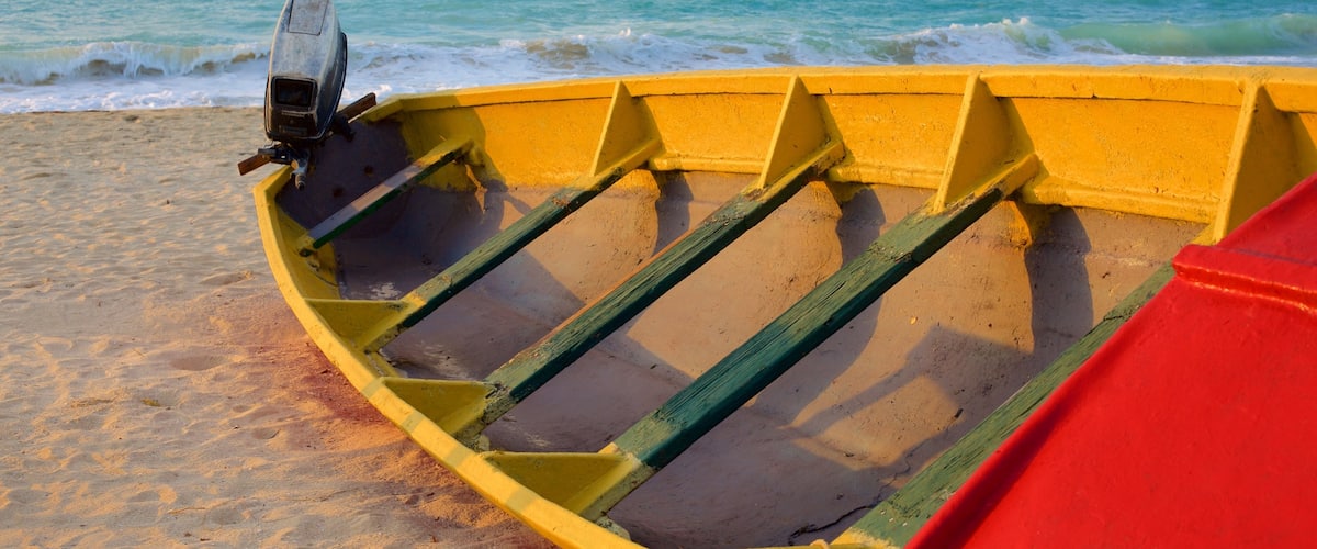 Negril showing a sandy beach and boating