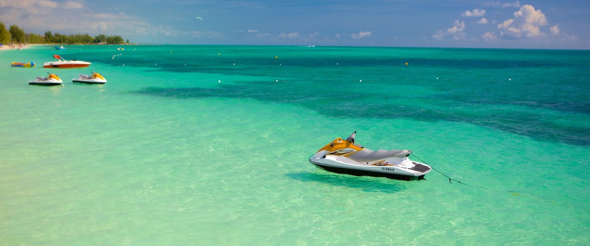 Taino Beach featuring jet skiing and general coastal views