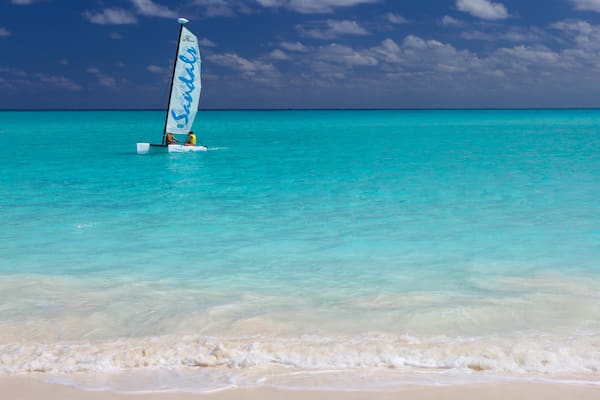 Emerald Bay featuring tropical scenes, sailing and a sandy beach