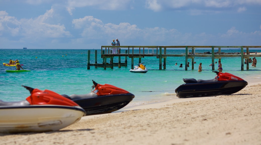 Taino Beach showing a sandy beach, jet skiing and general coastal views