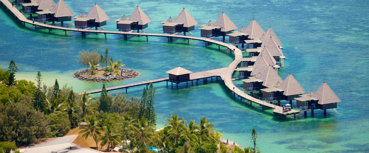 New Caledonia which includes coral, general coastal views and a luxury hotel or resort