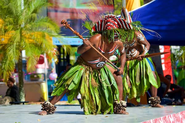 Place des Cocotiers which includes performance art as well as a small group of people
