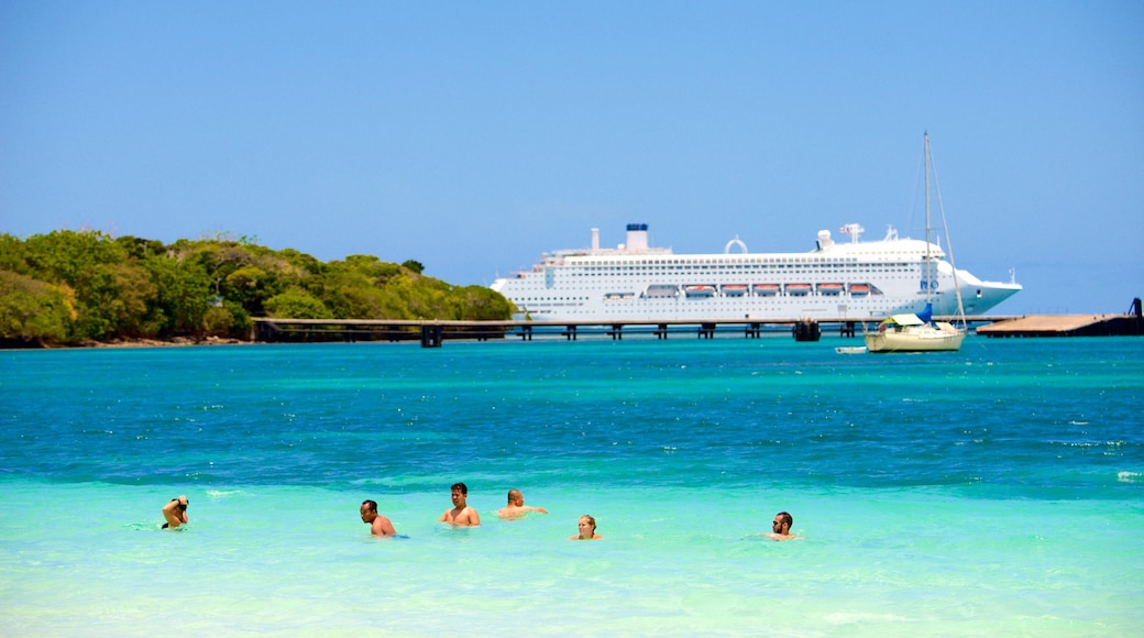 Kuto Beach which includes general coastal views, cruising and swimming