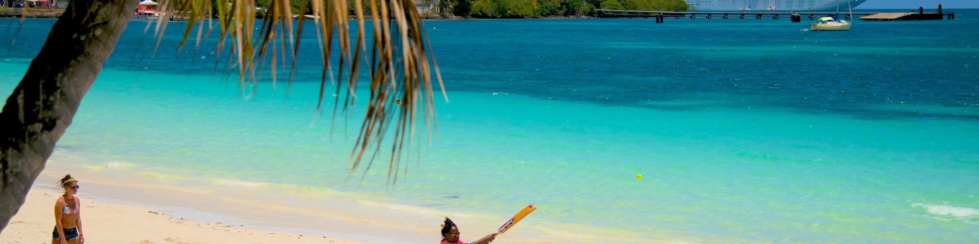 Kuto Beach which includes a beach as well as a small group of people