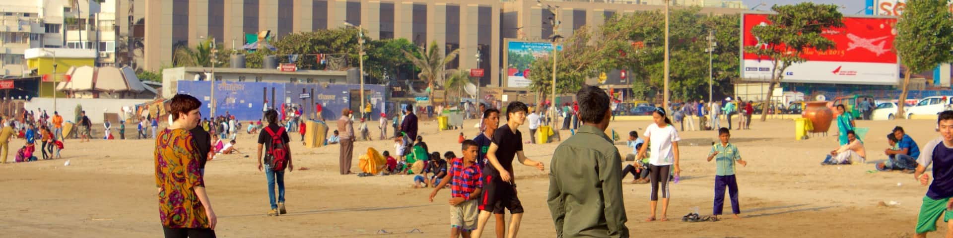 Juhu Beach featuring general coastal views as well as a large group of people