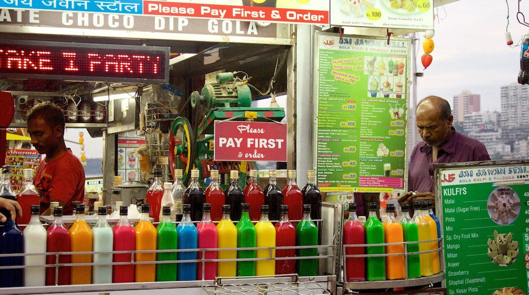 Girgaun Chowpatty featuring shopping as well as a small group of people