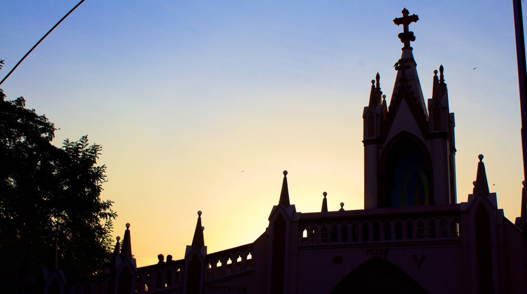 Mt. Mary Church featuring a church or cathedral and a sunset