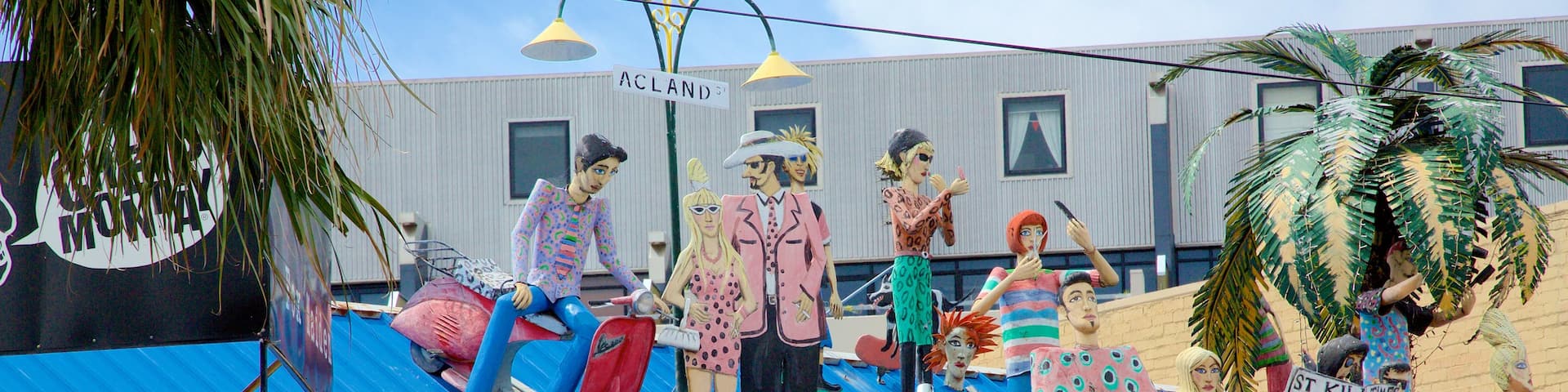 Acland Street featuring signage and outdoor art
