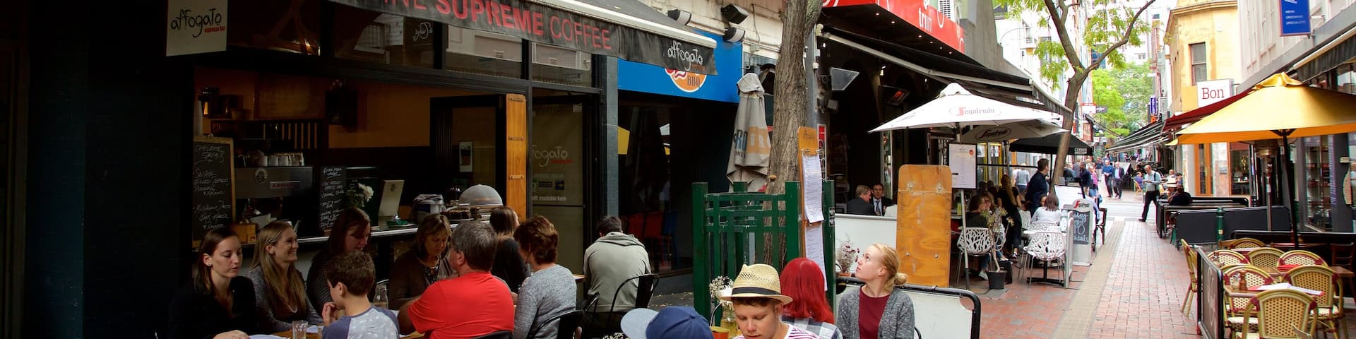 Hardware Lane which includes cafe lifestyle and outdoor eating as well as a large group of people