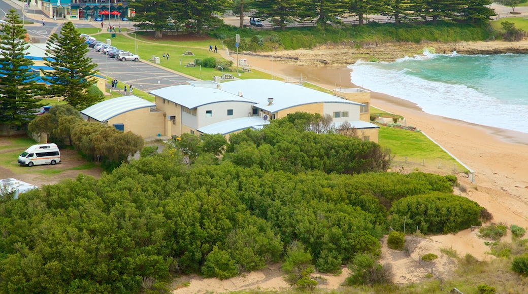 Port Campbell featuring a sandy beach and a coastal town