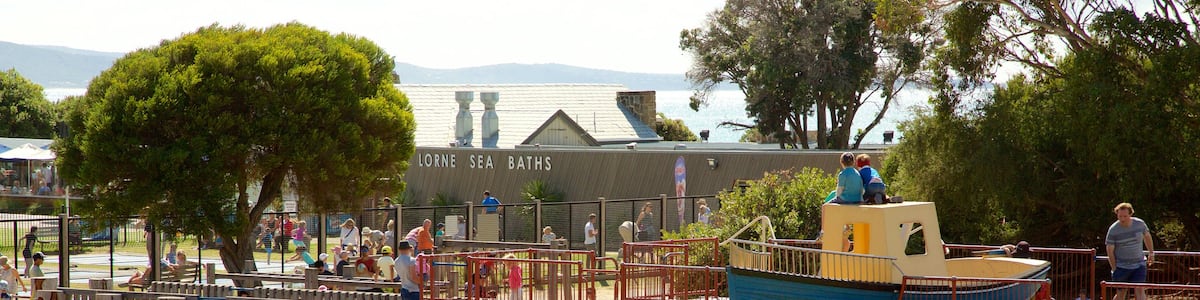 Lorne featuring a playground as well as a large group of people