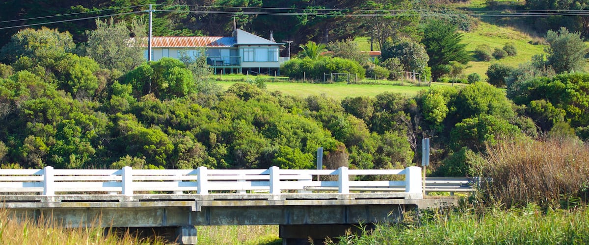 Skenes Creek which includes a bridge and a river or creek