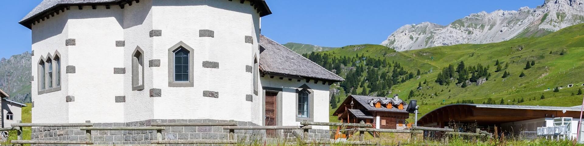 Moena featuring a church or cathedral and heritage elements