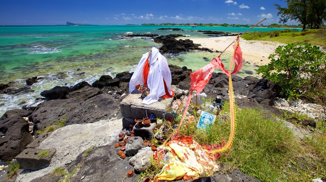 Flic-en-Flac showing religious elements, rocky coastline and general coastal views