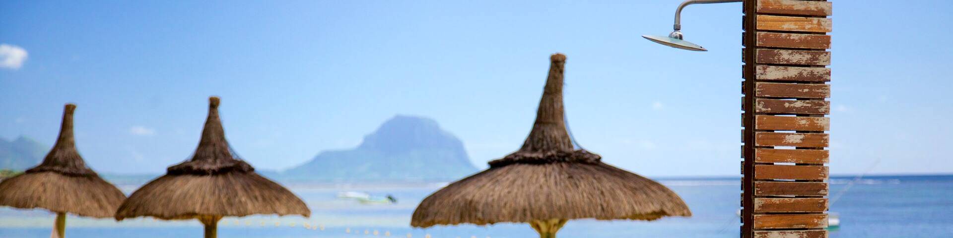 Flic-en-Flac which includes a luxury hotel or resort and a beach