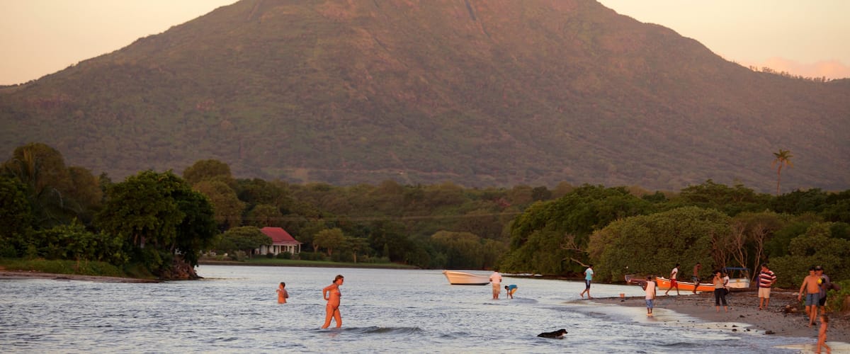 Tamarin which includes swimming, a sunset and mountains